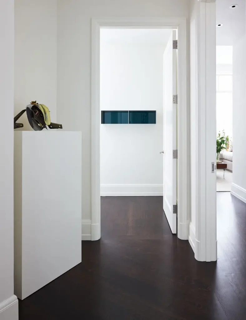 Pictures of fire-rated doors in a white apartment