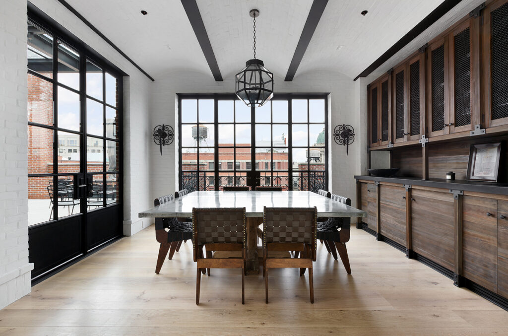 A dining room with hardwood floors