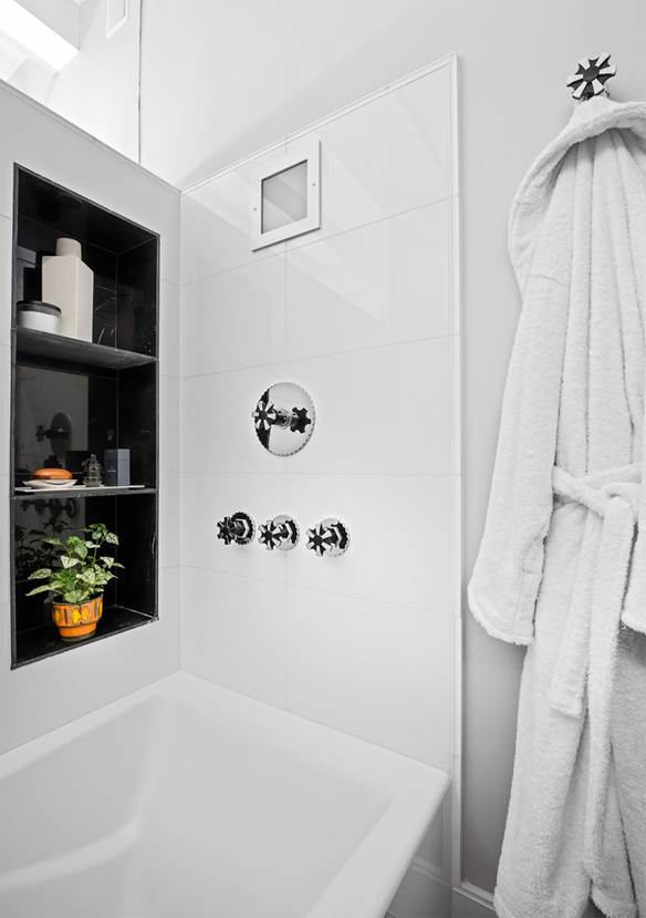 A beautiful shower with ornate handles